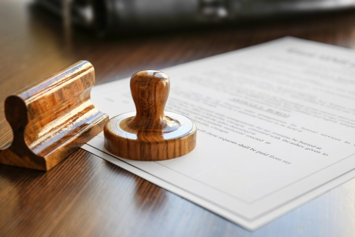 a cup of coffee sitting on top of a wooden table