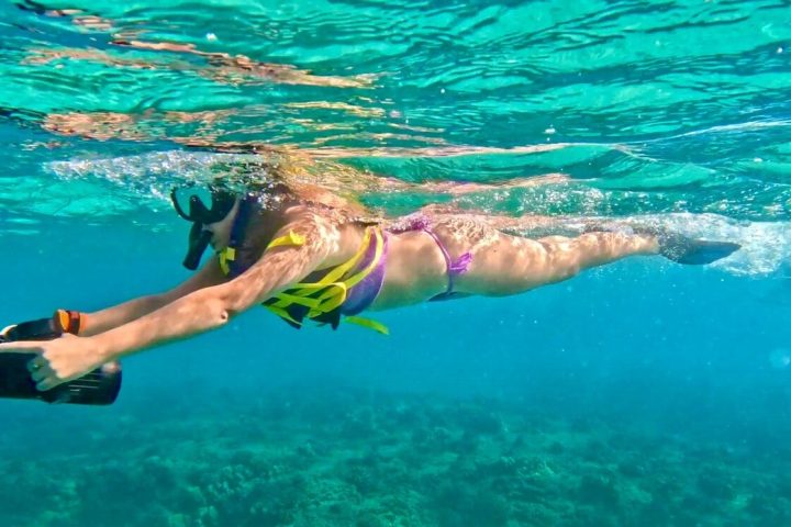 a person swimming in a body of water