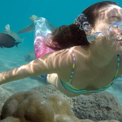 a statue of a person swimming in the water